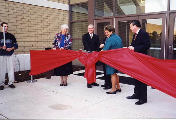 Shannon center ribbon cutting ceremony in front of the Shannon Center with a big bow