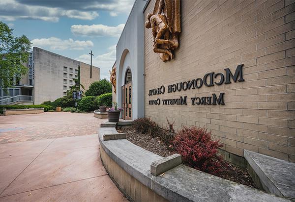 Picture of the side of the Mercy Ministry Center with a blue sky